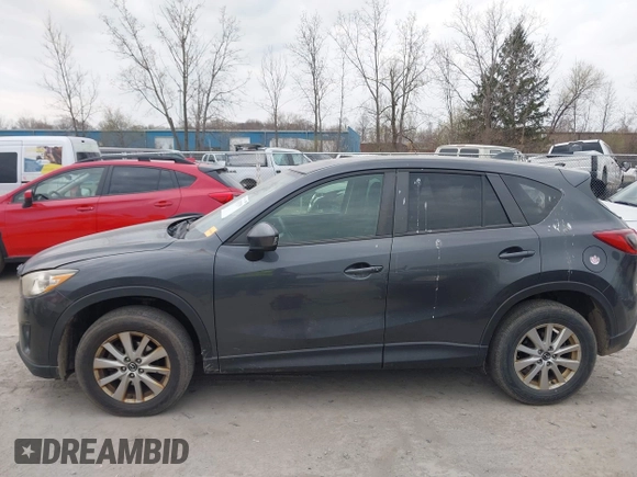 2015 Mazda CX-5 Touring with VIN JM3KE4CY1F0439016, listed as a IAAI auction lot 42039259 with 201,325 mi miles and . Bid and sale history available at carsss.com. Image 14.