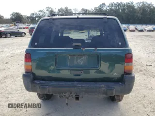 1996 Jeep Grand Cherokee Laredo with VIN 1J4GZ58S1TC340018, listed as a Copart auction lot 86571454 with 0 mi miles and Salvage Title. Bid and sale history available at carsss.com. Image 6.