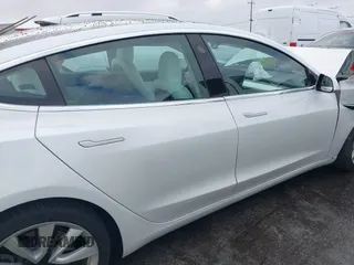 2020 Tesla Model 3 Standard Range Plus with VIN 5YJ3E1EA0LF741311, listed as a IAAI auction lot 41581931 with 43,284 mi miles. Bid and sale history available at carsss.com. Image 13.