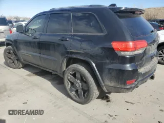 2014 Jeep Grand Cherokee Overland with VIN 1C4RJFCT2EC106002, listed as a Copart auction lot 48763675 with 143,011 mi miles and Salvage Title. Bid and sale history available at DreamBid. Image 2.