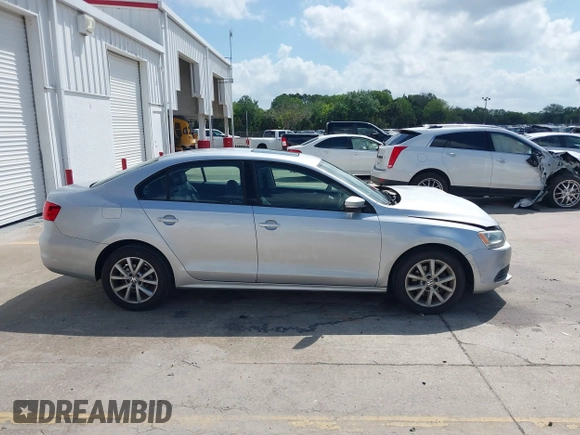 2012 Volkswagen Jetta Sedan SE w/Convenience with VIN 3VWDX7AJ1CM401939, listed as a IAAI auction lot 41941070 with 123,611 mi miles. Bid and sale history available at carsss.com. Image 13.