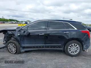 2018 Cadillac XT5 FWD z VIN 1GYKNARS3JZ137039, wystawiony jako IAAI lot #41667581 z przebiegiem 98 281 mil mil oraz . Historia ofert i sprzedaży dostępna na DreamBid. Obrazek 15.