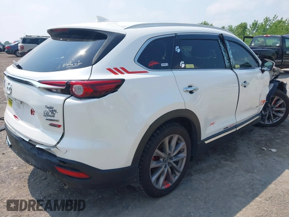 2020 Mazda CX-9 Grand Touring with VIN JM3TCBDY3L0410674, listed as a IAAI auction lot 42389157 with 130,519 mi miles and . Bid and sale history available at DreamBid. Image 4.
