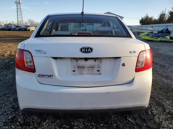 2010 Kia Rio LX with VIN KNADH4A3XA6624135, listed as a Copart auction lot 45455745 with 143,623 mi miles and Salvage Title. Bid and sale history available at carsss.com. Image 6.