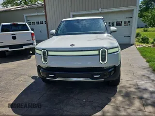 2023 Rivian R1T Adventure z VIN 7FCTGAAA1PN020478, wystawiony jako IAAI lot #42361936 z przebiegiem 443 mil mil oraz . Historia ofert i sprzedaży dostępna na DreamBid. Obrazek 6.