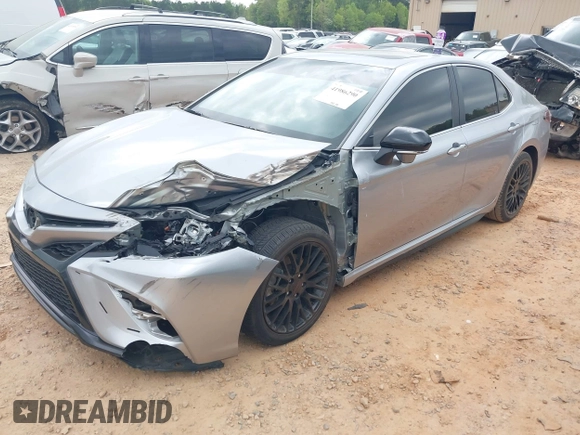 2023 Toyota Camry SE with VIN 4T1T11AK1PU736752, listed as a IAAI auction lot 41986290 with 38,636 mi miles and . Bid and sale history available at DreamBid. Image 2.