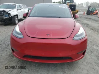 2023 Tesla Model Y Performance z VIN 7SAYGDEF2PF857843, wystawiony jako Copart lot #57324255 z przebiegiem 22 618 mil mil oraz Szkoda całkowita • Salvage title. Historia ofert i sprzedaży dostępna na DreamBid. Obrazek 5.