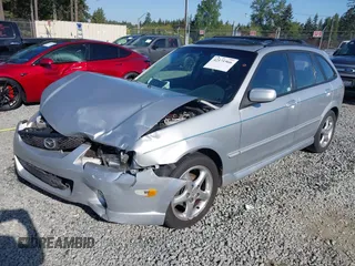 2002 Mazda Protege z VIN JM1BJ246221493337, wystawiony jako IAAI lot #42171966 z przebiegiem 244 609 mil mil oraz . Historia ofert i sprzedaży dostępna na DreamBid. Obrazek 2.