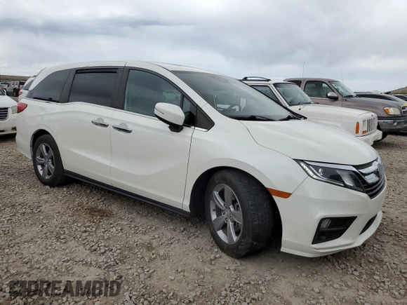 2018 Honda Odyssey EX-L with VIN 5FNRL6H71JB059936, listed as a Copart auction lot 53403635 with 94,745 mi miles and Salvage Title. Bid and sale history available at DreamBid. Image 4.