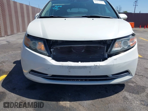 2015 Honda Odyssey EX-L with VIN 5FNRL5H67FB017554, listed as a IAAI auction lot 41974821 with 76,130 mi miles and . Bid and sale history available at carsss.com. Image 6.