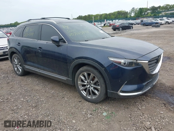 2018 Mazda CX-9 Grand Touring with VIN JM3TCBDY8J0209737, listed as a IAAI auction lot 42374826 with Not provided miles and . Bid and sale history available at DreamBid. Image 1.