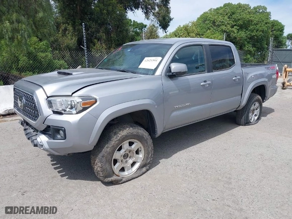 2019 Toyota Tacoma 4WD SR with VIN 3TMCZ5AN4KM194526, listed as a IAAI auction lot 42021504 with 87,767 mi miles. Bid and sale history available at carsss.com. Image 2.