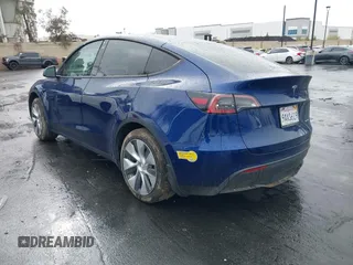 2022 Tesla Model Y Long Range with VIN 7SAYGDEE7NF409294, listed as a IAAI auction lot 41845261 with 73,116 mi miles and . Bid and sale history available at DreamBid. Image 3.