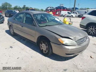 2006 Ford Taurus SE with VIN 1FAFP53U96A223924, listed as a IAAI auction lot 41828443 with 114,653 mi miles. Bid and sale history available at carsss.com. Image 1.