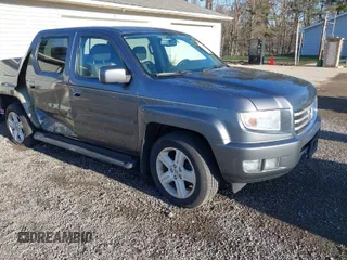 2013 Honda Ridgeline RTL with VIN 5FPYK1F55DB004842, listed as a IAAI auction lot 41843327 with 178,997 mi miles. Bid and sale history available at carsss.com. Image 1.