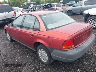1997 Saturn SL with VIN 1G8ZF5289VZ138039, listed as a IAAI auction lot 39432871 with 125,022 mi miles. Bid and sale history available at carsss.com. Image 3.