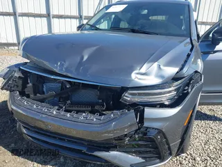 2024 Volkswagen Tiguan SE R-Line Black with VIN 3VVCB7AX2RM114556, listed as a IAAI auction lot 41887373 with 7,013 mi miles and . Bid and sale history available at DreamBid. Image 6.