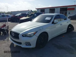 2015 Infiniti Q50 Premium z VIN JN1BV7AR5FM415612, wystawiony jako IAAI lot #41726943 z przebiegiem 120 534 mil mil oraz . Historia ofert i sprzedaży dostępna na DreamBid. Obrazek 2.