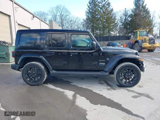 2023 Jeep Wrangler 4xe Sahara with VIN 1C4JJXP62PW613040, listed as a IAAI auction lot 41489171 with 36,818 mi miles. Bid and sale history available at carsss.com. Image 14.