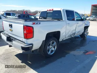 2018 Chevrolet Silverado 1500 LT with VIN 3GCUKREC3JG634354, listed as a IAAI auction lot 41734436 with 135,846 mi miles. Bid and sale history available at carsss.com. Image 4.