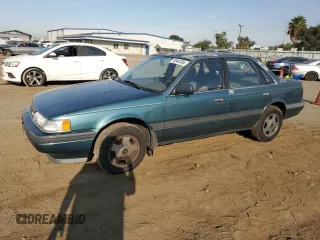 1992 Mazda 626 z VIN 1YVGD22B5N5212605, wystawiony jako Copart lot #74945704 z przebiegiem 99 659 mil mil oraz Tytuł czysty. Historia ofert i sprzedaży dostępna na DreamBid. Obrazek 1.