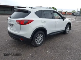 2016 Mazda CX-5 Touring with VIN JM3KE4CY0G0903723, listed as a IAAI auction lot 41966516 with 107,569 mi miles. Bid and sale history available at carsss.com. Image 4.