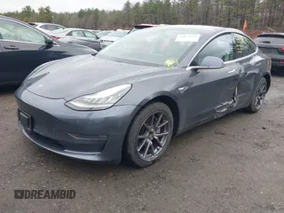 2019 Tesla Model 3 Mid Range with VIN 5YJ3E1EA3KF307415, listed as a IAAI auction lot 41673239 with 42,895 mi miles and . Bid and sale history available at DreamBid. Image 2.