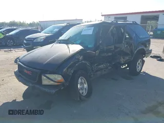 2001 GMC Jimmy SLS Base with VIN 1GKCS18W11K101127, listed as a IAAI auction lot 41534081 with 124,657 mi miles. Bid and sale history available at carsss.com. Image 2.