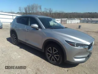 2018 Mazda CX-5 Grand Touring z VIN JM3KFADM0J0316971, wystawiony jako IAAI lot #41656704 z przebiegiem 90 827 mil mil oraz . Historia ofert i sprzedaży dostępna na DreamBid. Obrazek 1.