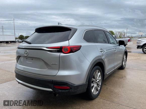 2017 Mazda CX-9 Grand Touring with VIN JM3TCADY7H0136915, listed as a Copart auction lot 57106855 with 135,872 mi miles and Clean title. Bid and sale history available at DreamBid. Image 4.
