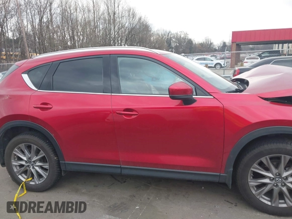 2020 Mazda CX-5 Grand Touring with VIN JM3KFADMXL0842026, listed as a IAAI auction lot 41477339 with 60,755 mi miles. Bid and sale history available at carsss.com. Image 13.