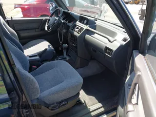 1995 Mitsubishi Montero z VIN JA4MR41H4SJ006684, wystawiony jako IAAI lot #42389482 z przebiegiem 399 099 mil mil oraz . Historia ofert i sprzedaży dostępna na DreamBid. Obrazek 5.