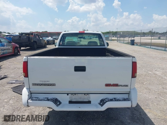 1997 GMC Sonoma z VIN 1GTCS1441VK518317, wystawiony jako IAAI lot #41942735 z przebiegiem 75 862 mil mil oraz . Historia ofert i sprzedaży dostępna na DreamBid. Obrazek 16.