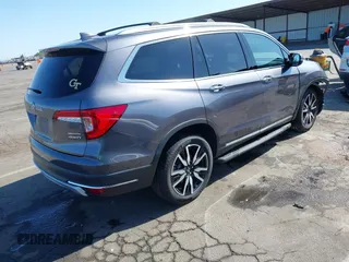 2021 Honda Pilot Touring 8-Passenger with VIN 5FNYF6H97MB034399, listed as a IAAI auction lot 42303419 with 50,034 mi miles and . Bid and sale history available at DreamBid. Image 4.