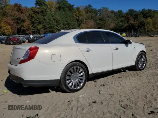 2013 Lincoln MKS z VIN 1LNHL9DK0DG605400, wystawiony jako Copart lot #77071034 z przebiegiem 73 450 mil mil oraz Szkoda całkowita • Salvage title. Historia ofert i sprzedaży dostępna na DreamBid. Obrazek 3.