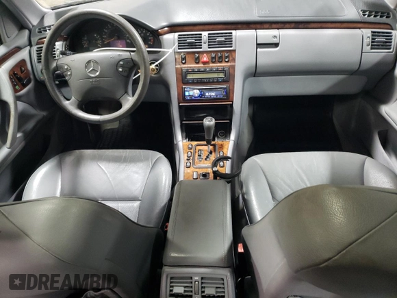 2000 Mercedes-Benz E-Class with VIN WDBJF82J1YX030388, listed as a Copart auction lot 86384974 with 212,596 mi miles and Salvage Title. Bid and sale history available at carsss.com. Image 8.