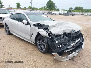 2022 BMW 8 Series M850i with VIN WBAGV8C06NCJ32676, listed as a IAAI auction lot 42299008 with Not provided miles and . Bid and sale history available at DreamBid. Image 1.