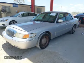 2001 Mercury Grand Marquis LS z VIN 2MEFM75W91X660964, wystawiony jako IAAI lot #42250931 z przebiegiem 74 462 mil mil oraz . Historia ofert i sprzedaży dostępna na DreamBid. Obrazek 2.