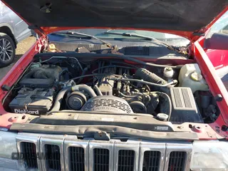 1997 Jeep Grand Cherokee Laredo with VIN 1J4GZ58S0VC550242, listed as a IAAI auction lot 41032114 with 185,307 mi miles. Bid and sale history available at carsss.com. Image 10.