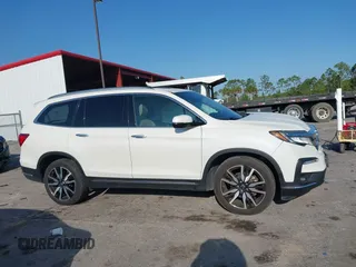 2019 Honda Pilot Touring 8-Passenger z VIN 5FNYF6H98KB016992, wystawiony jako IAAI lot #42275295 z przebiegiem 82 154 mil mil oraz . Historia ofert i sprzedaży dostępna na DreamBid. Obrazek 13.