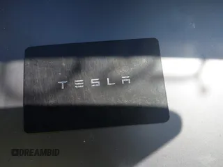 2023 Tesla Model Y Long Range with VIN 7SAYGDEE2PF883687, listed as a IAAI auction lot 41589837 with 36,890 mi miles. Bid and sale history available at carsss.com. Image 11.