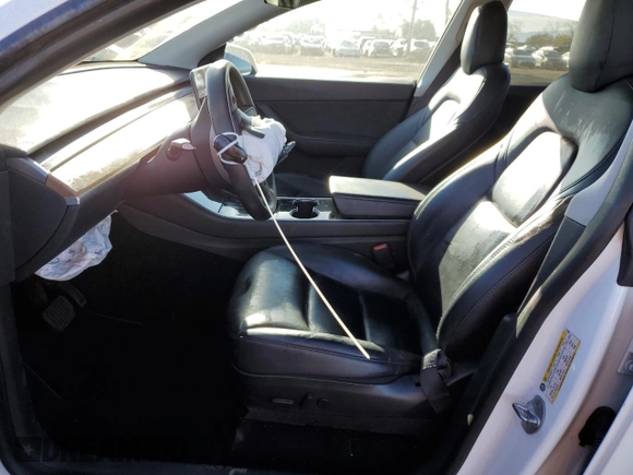 2020 Tesla Model Y Long Range with VIN 5YJYGDEE4LF015455, listed as a Copart auction lot 84223984 with 77,398 mi miles and Salvage Title. Bid and sale history available at DreamBid. Image 7.