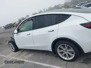 2022 Tesla Model Y Long Range z VIN 7SAYGDEE4NF315356, wystawiony jako IAAI lot #41571151 z przebiegiem 1 056 mil mil oraz . Historia ofert i sprzedaży dostępna na DreamBid. Obrazek 14.