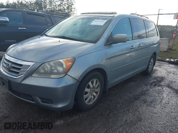 2010 Honda Odyssey EX-L with VIN 5FNRL3H70AB027137, listed as a IAAI auction lot 41659981 with 202,256 mi miles and . Bid and sale history available at DreamBid. Image 2.