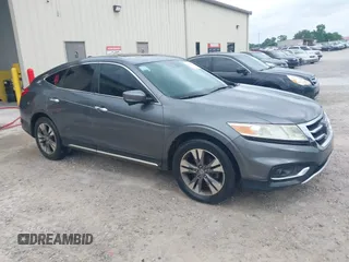 2013 Honda Crosstour EX-L z VIN 5J6TF1H56DL002352, wystawiony jako IAAI lot #42303791 z przebiegiem 178 443 mil mil oraz . Historia ofert i sprzedaży dostępna na DreamBid. Obrazek 1.
