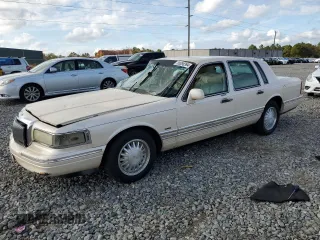 1995 Lincoln Town Car Cartier z VIN 1LNLM83W6SY689378, wystawiony jako Copart lot #80098394 z przebiegiem 228 064 mil mil oraz Szkoda całkowita • Salvage title. Historia ofert i sprzedaży dostępna na DreamBid. Obrazek 1.