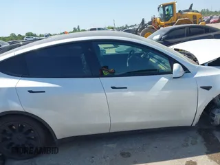 2021 Tesla Model Y Long Range with VIN 5YJYGDEE0MF265339, listed as a IAAI auction lot 41975058 with 51,292 mi miles and . Bid and sale history available at DreamBid. Image 13.