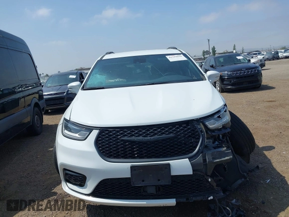 2021 Chrysler Pacifica Touring with VIN 2C4RC1FG7MR605587, listed as a IAAI auction lot 42329028 with 111,305 mi miles and . Bid and sale history available at DreamBid. Image 12.