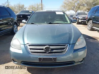 2002 Nissan Altima SE with VIN 1N4BL11D72C700998, listed as a IAAI auction lot 41369017 with 117,148 mi miles. Bid and sale history available at carsss.com. Image 12.