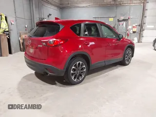 2016 Mazda CX-5 Grand Touring with VIN JM3KE4DY6G0690923, listed as a IAAI auction lot 41875553 with 179,489 mi miles. Bid and sale history available at carsss.com. Image 4.